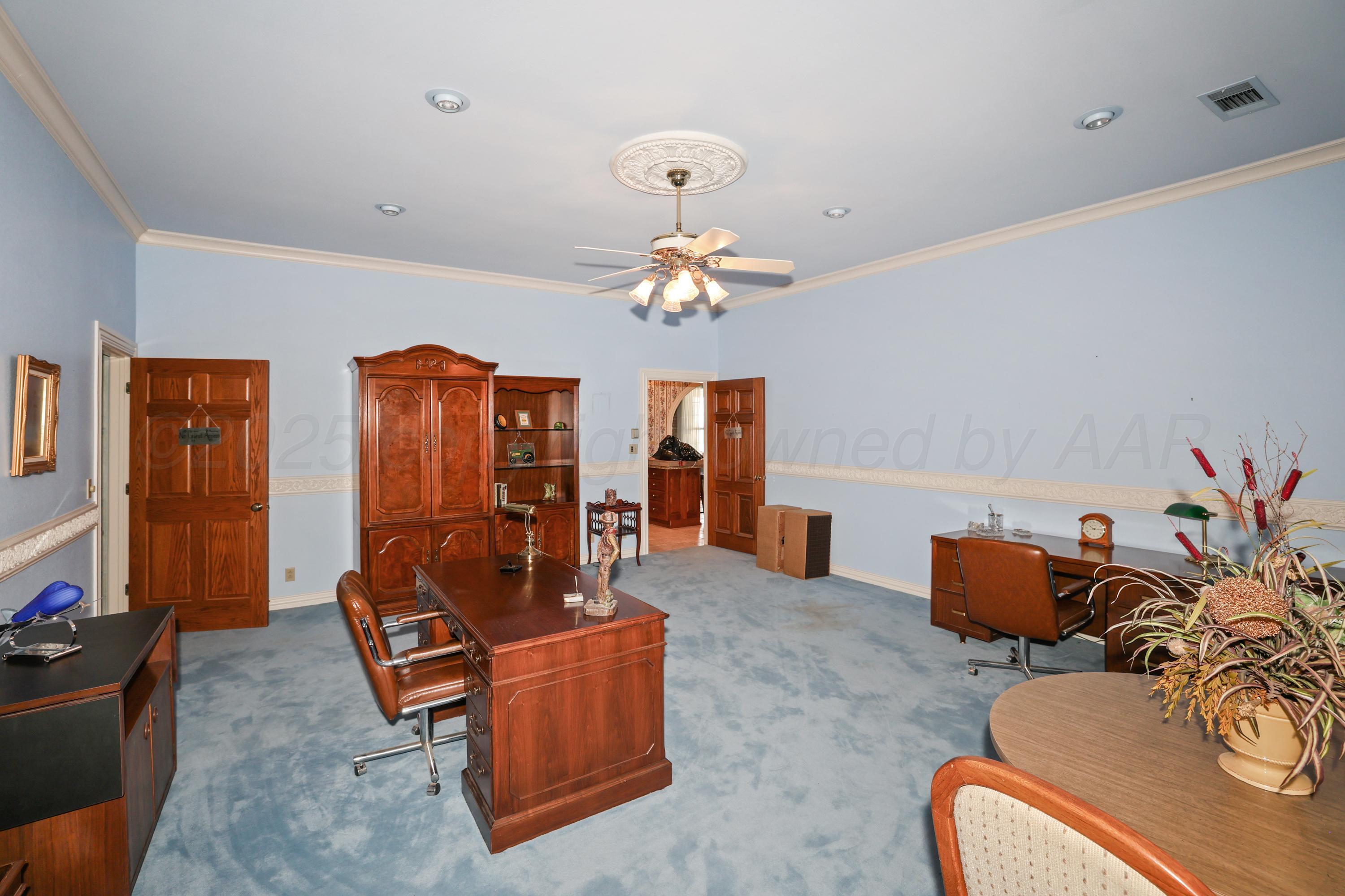 1401 County Road K Panhandle, TX 79068 - Photo 19 of 53 a living room with furniture chandelier and a chandelier
