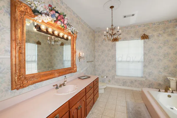 a bathroom with a tub and a shower