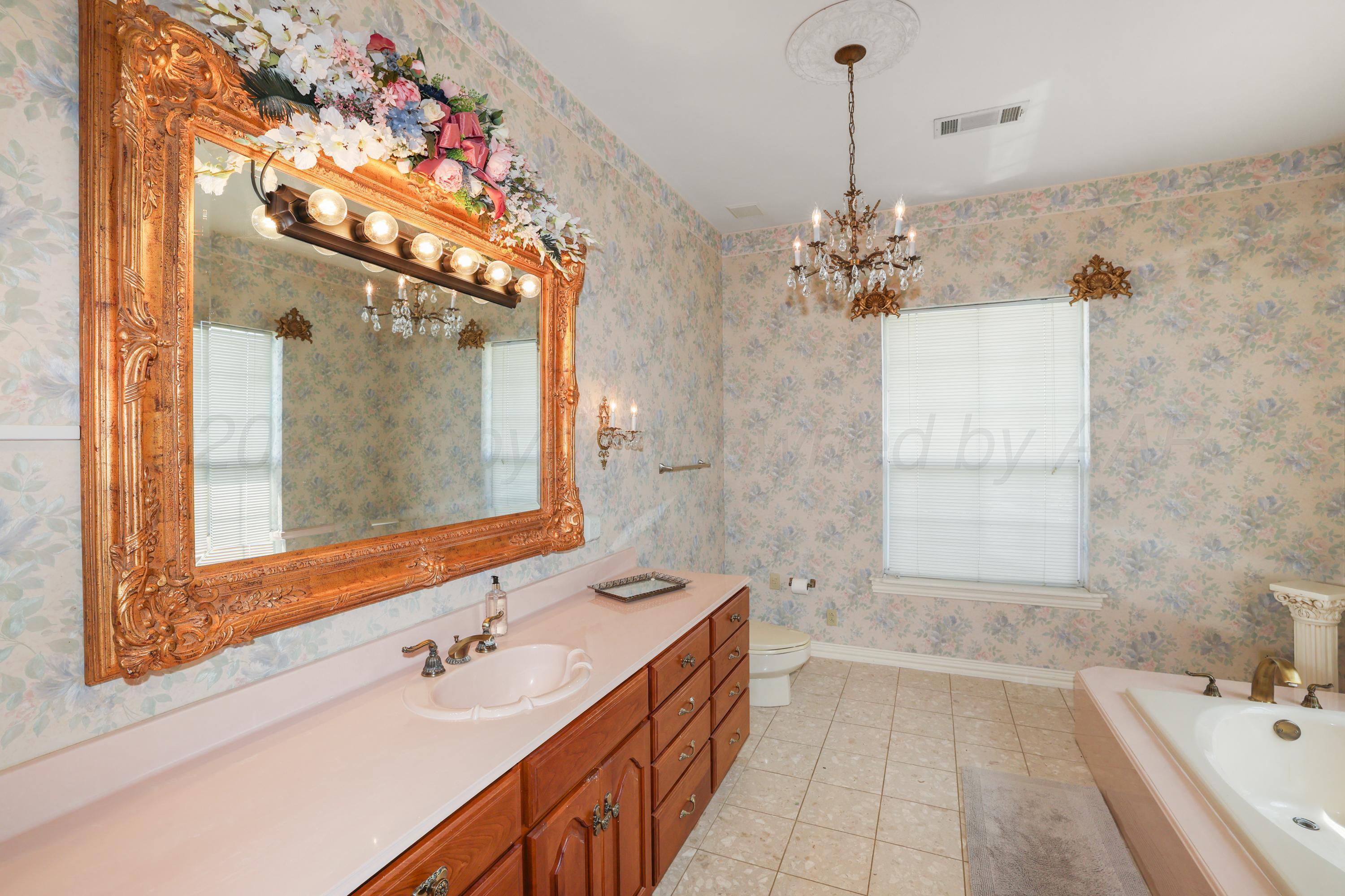 1401 County Road K Panhandle, TX 79068 - Photo 23 of 53 a bathroom with a double vanity sink mirror and double