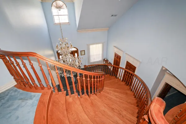 a dining room with furniture a rug and wooden floor