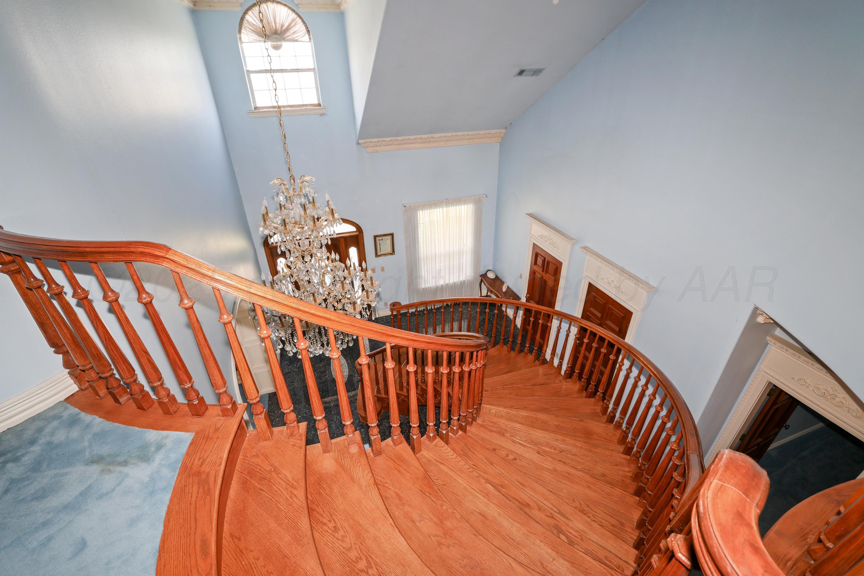 1401 County Road K Panhandle, TX 79068 - Photo 3 of 53 a dining room with furniture a rug and wooden floor