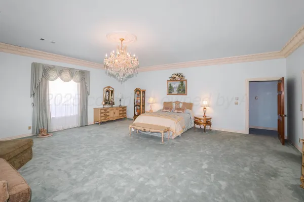 a bedroom with bed and window