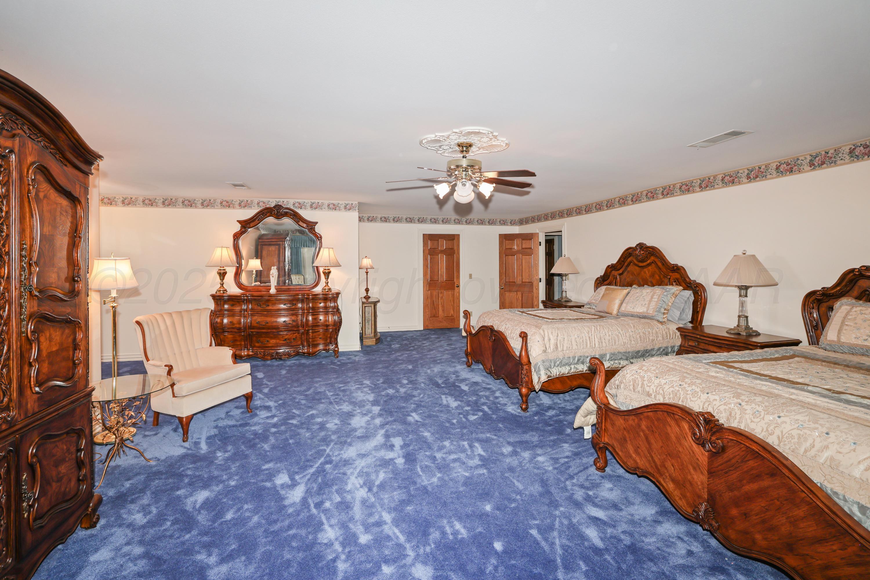 1401 County Road K Panhandle, TX 79068 - Photo 35 of 53 a bedroom with bed and window