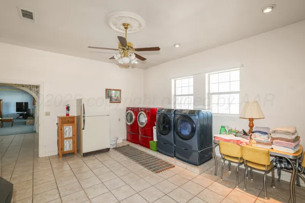 a spacious bathroom with a double vanity sink a mirror and a shower