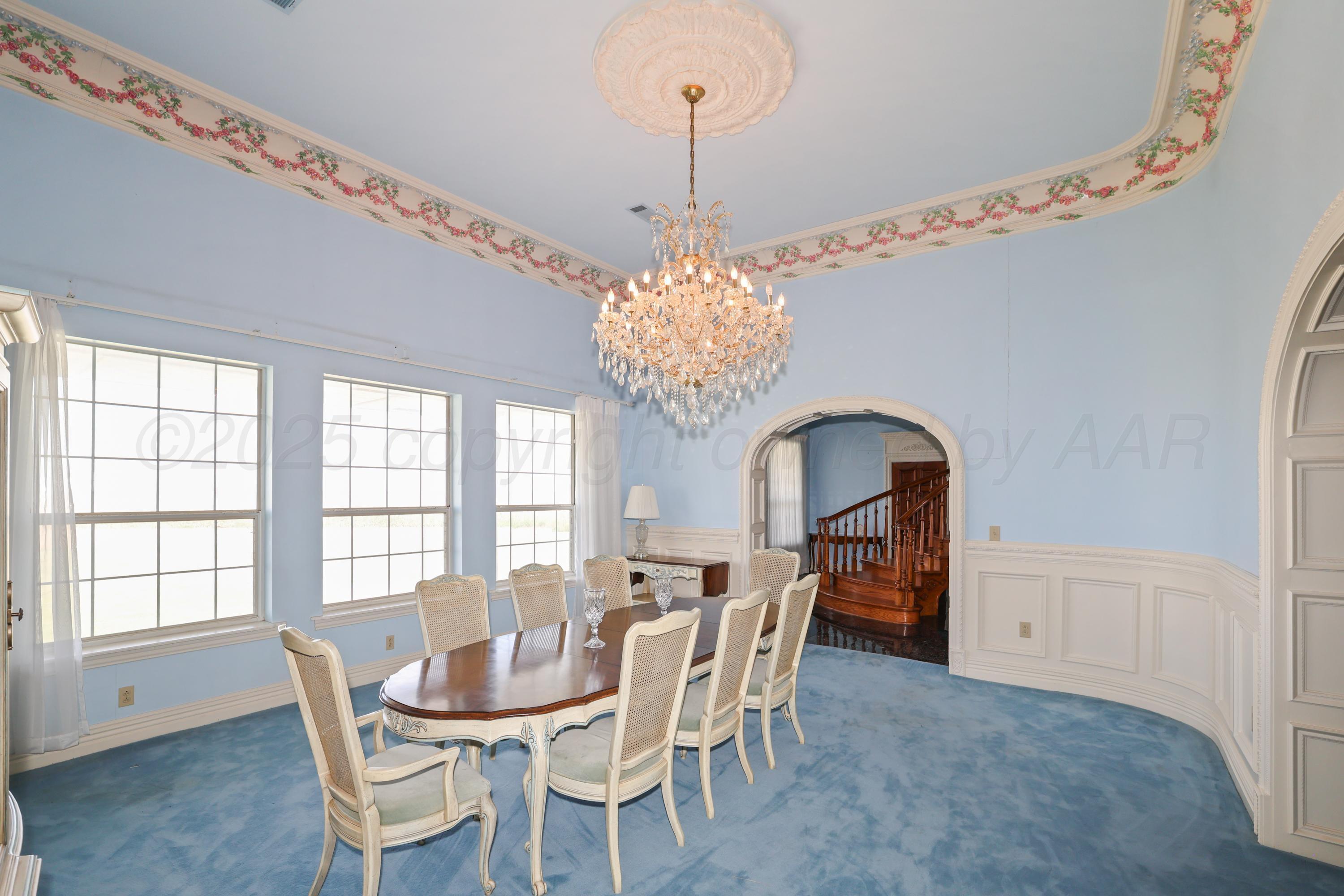1401 County Road K Panhandle, TX 79068 - Photo 10 of 53 a dining room with furniture a chandelier and window