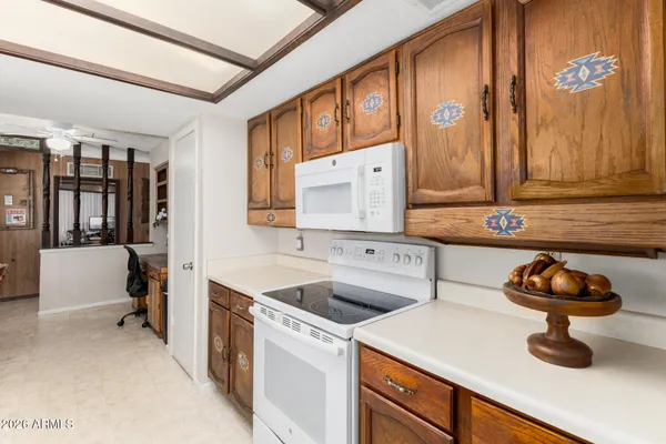 a kitchen that has a sink and a stove in it