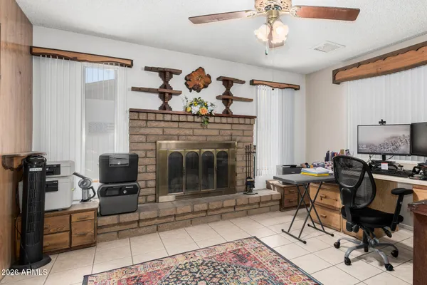 a living room with furniture a rug and a fireplace