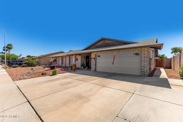 a front view of a house with a garage