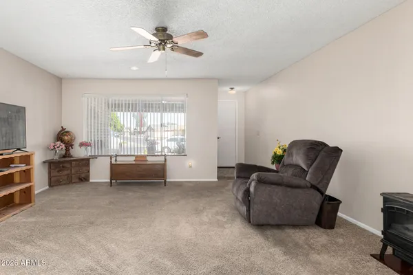 a living room with furniture and a window