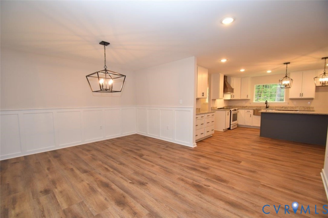 1749 Hollands Road Palmyra, VA 22963 - Photo 17 of 40 Unfurnished dining area with a chandelier, wainsco