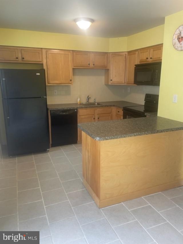 3608 Walnut Ridge Drive Pottstown, PA 19464 - Photo 11 of 28 a kitchen with a sink a stove top oven and cabinets