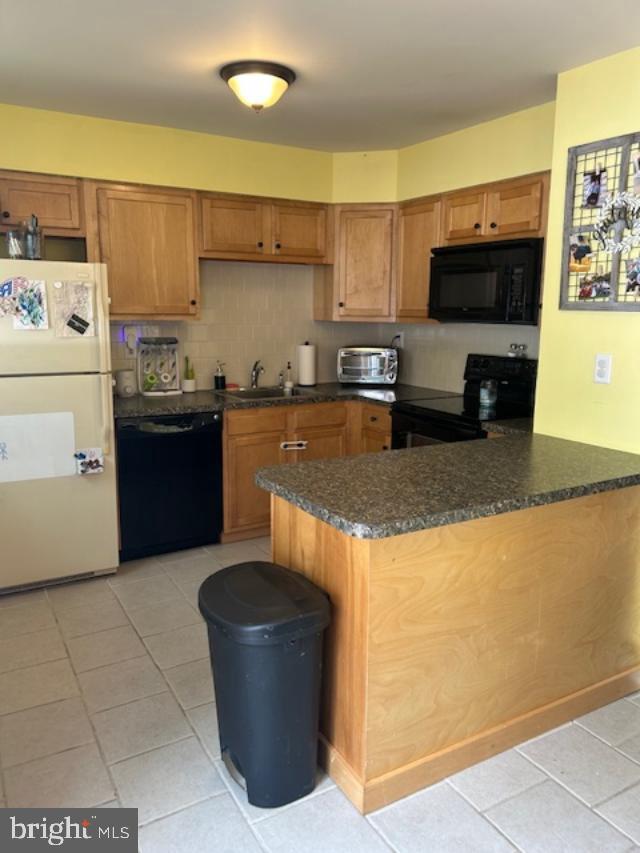 3608 Walnut Ridge Drive Pottstown, PA 19464 - Photo 14 of 28 a kitchen with stainless steel appliances granite countertop a stove a sink and a refrigerator