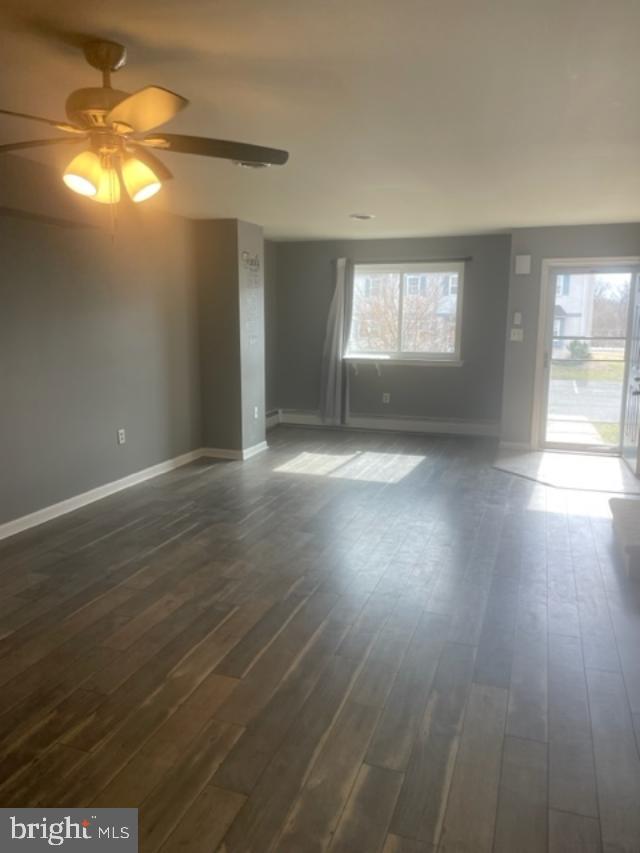 3608 Walnut Ridge Drive Pottstown, PA 19464 - Photo 6 of 28 an empty room with wooden floor and windows