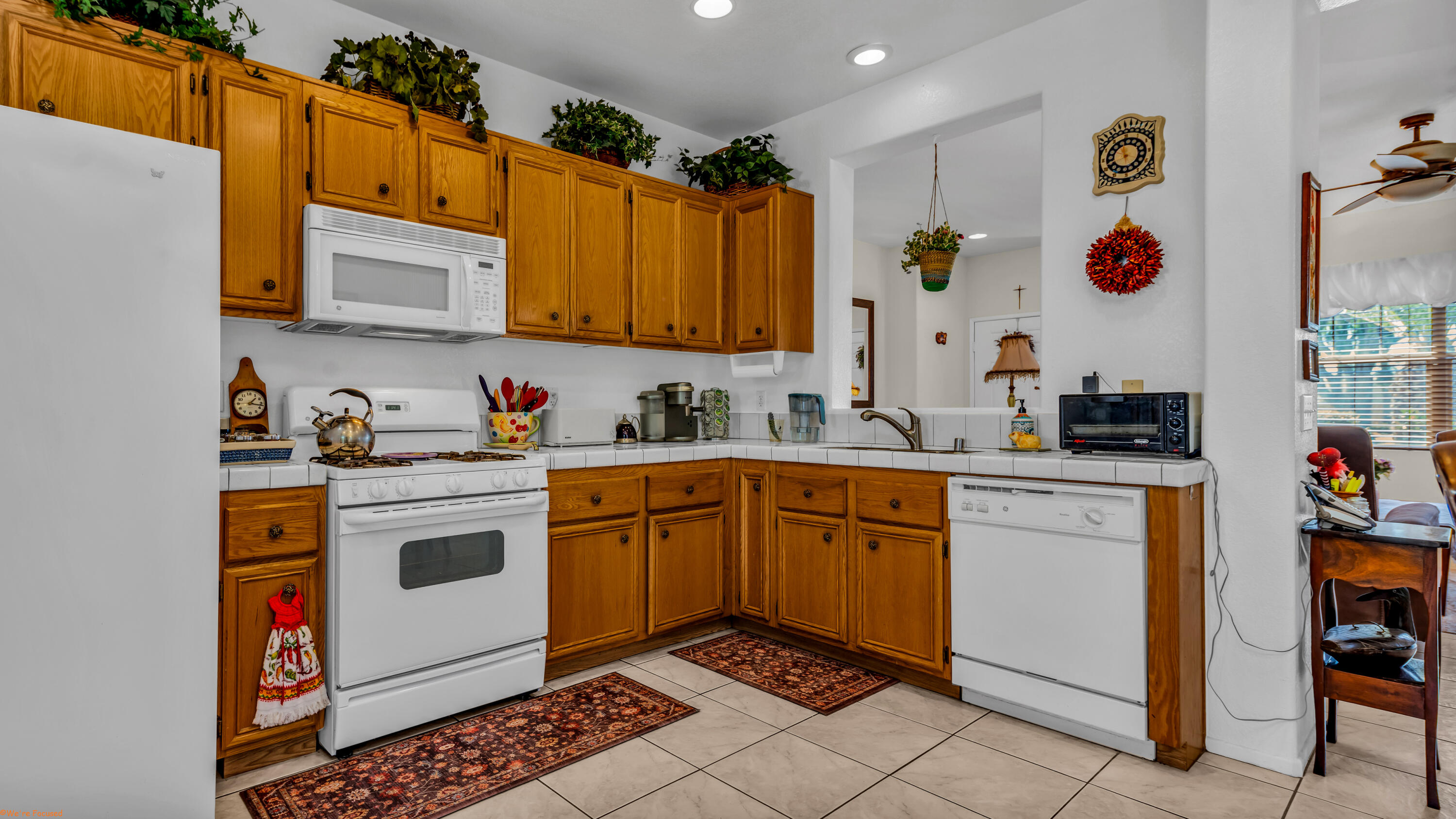 83644 Jaderock Road Coachella, CA 92236 - Photo 12 of 42 a kitchen with a sink and cabinets