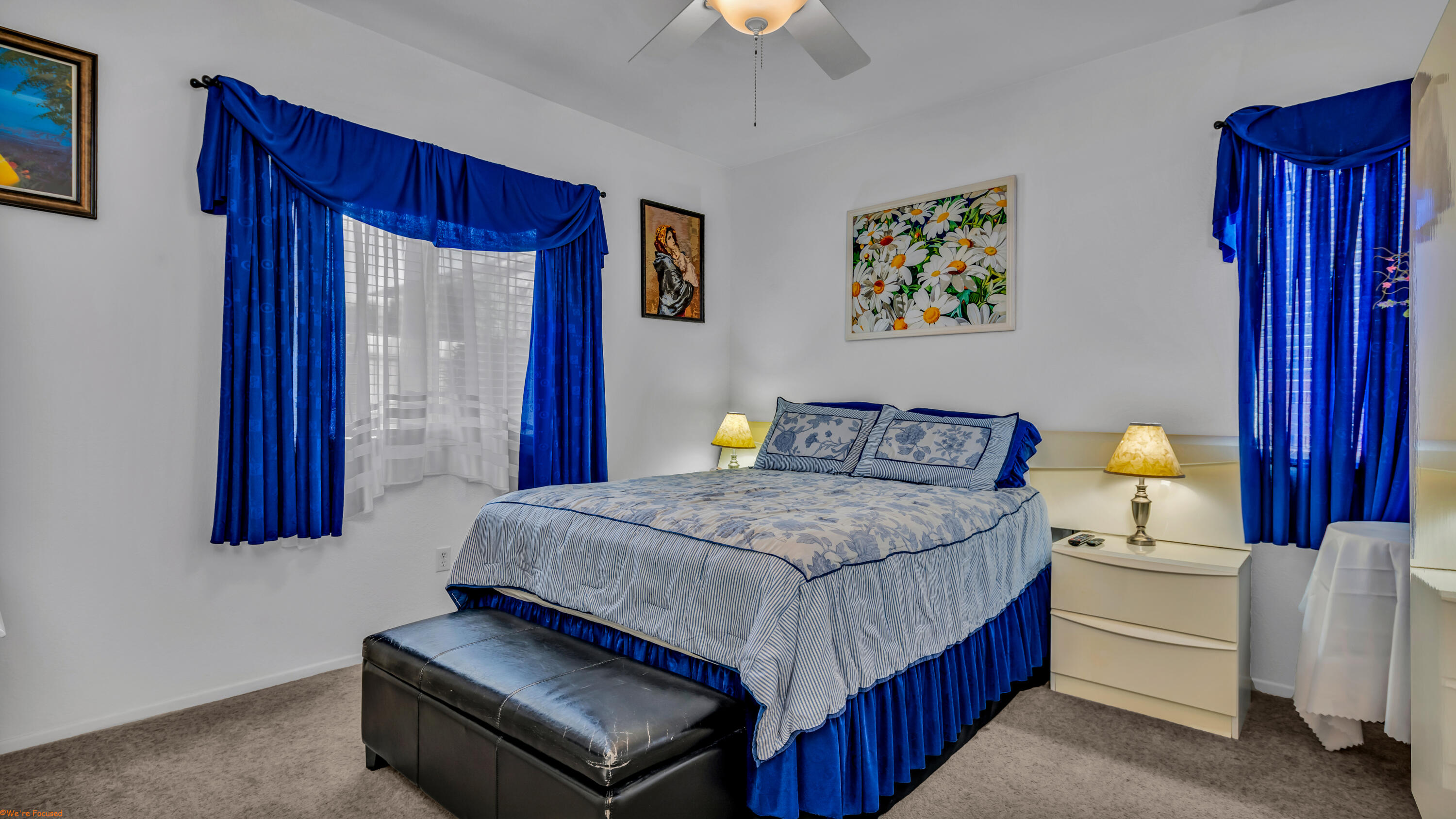 83644 Jaderock Road Coachella, CA 92236 - Photo 13 of 42 a bedroom with a bed and a chandelier