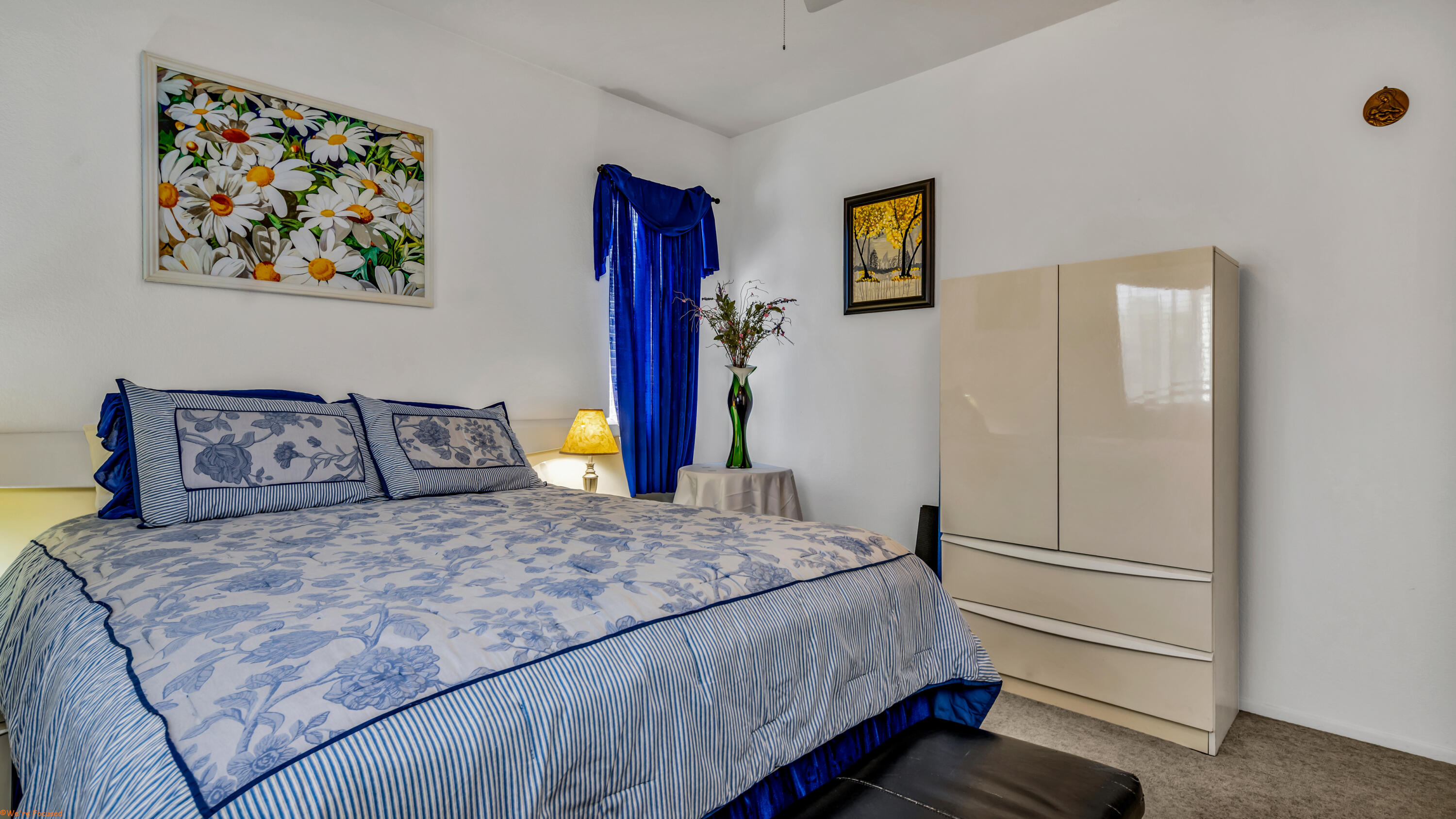 83644 Jaderock Road Coachella, CA 92236 - Photo 14 of 42 a bedroom with a bed and a painting on the wall