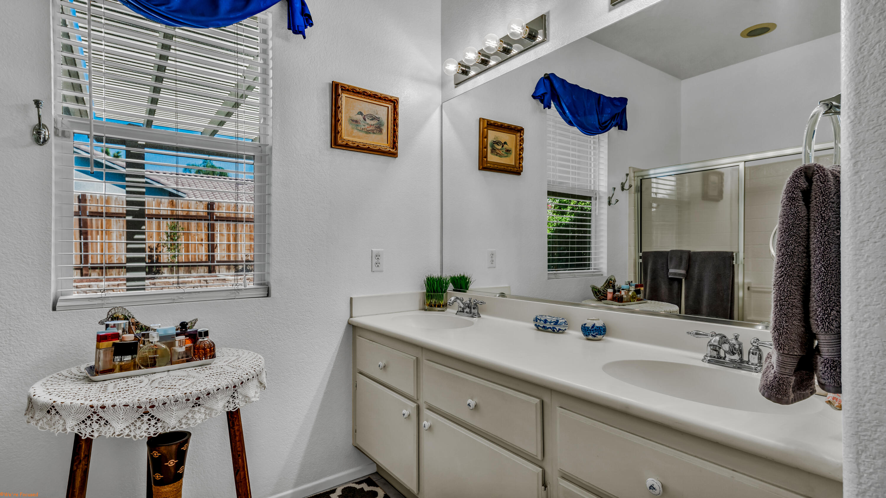 83644 Jaderock Road Coachella, CA 92236 - Photo 16 of 42 a bathroom with a sink a mirror and a window