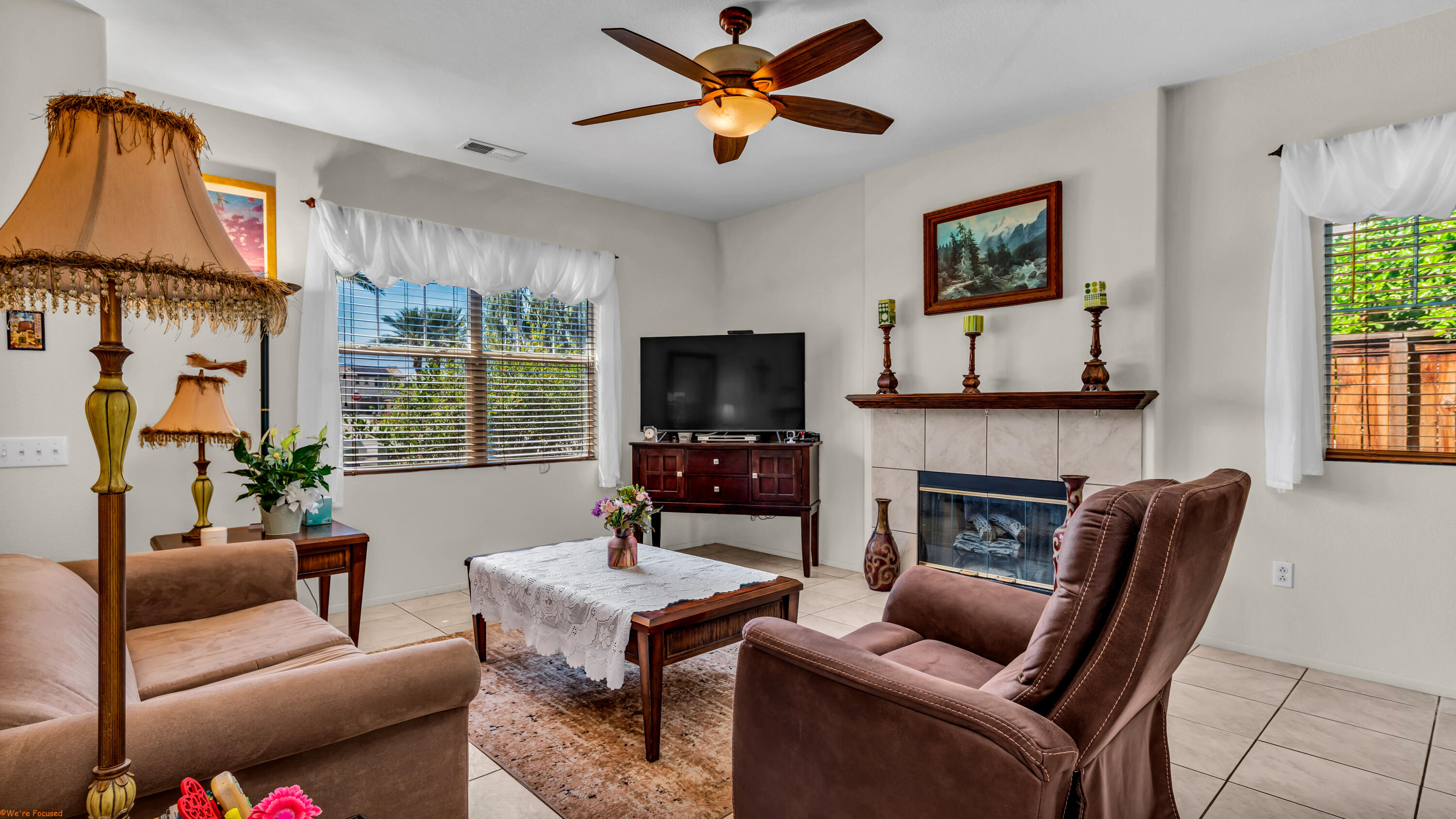 83644 Jaderock Road Coachella, CA 92236 - Photo 5 of 42 a living room with furniture a flat screen tv and a fireplace