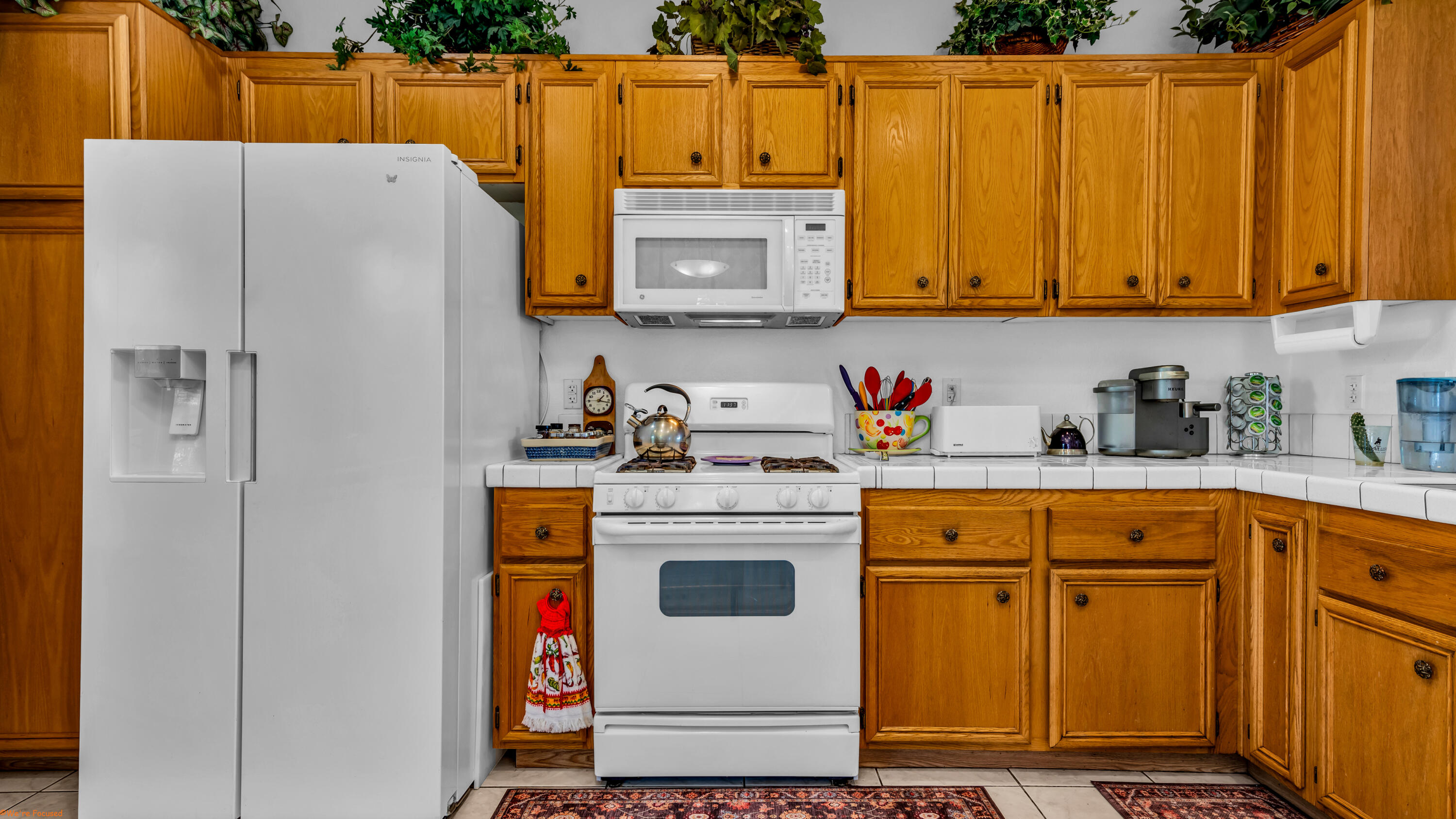 83644 Jaderock Road Coachella, CA 92236 - Photo 10 of 42 a white refrigerator freezer sitting inside of a kitchen