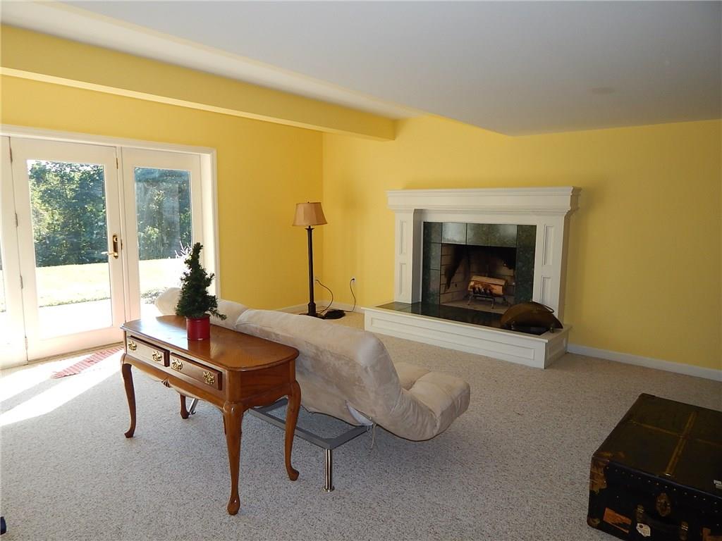 409 West Cruikshank Road Valencia, PA 16059 - Photo 22 of 25 Fireplace area. Lower level to be repainted.
