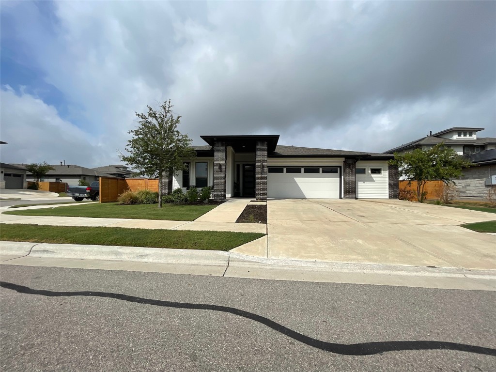 a view of house with yard