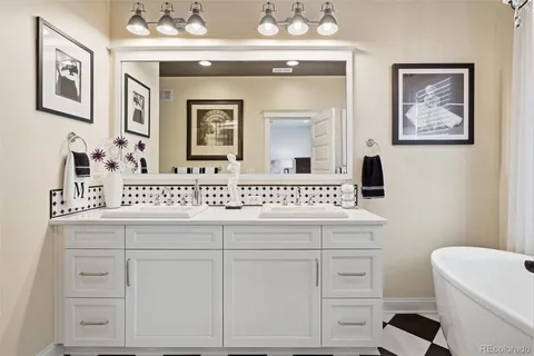 a bathroom with a sink a vanity and a mirror