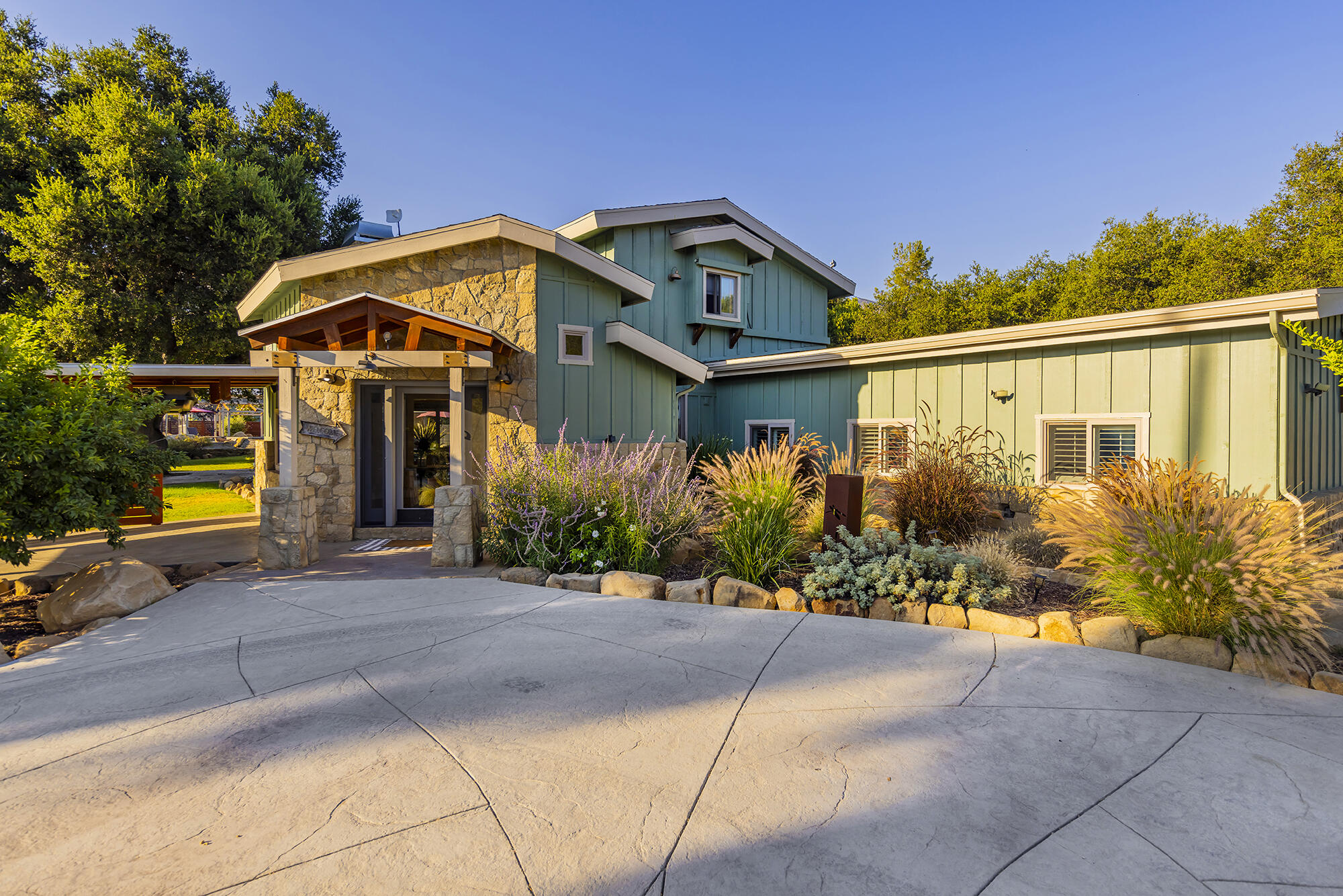 12475 Christmas Tree Road Ojai, CA 93023 - Photo 3 of 50 a front view of a house with a yard and potted plants