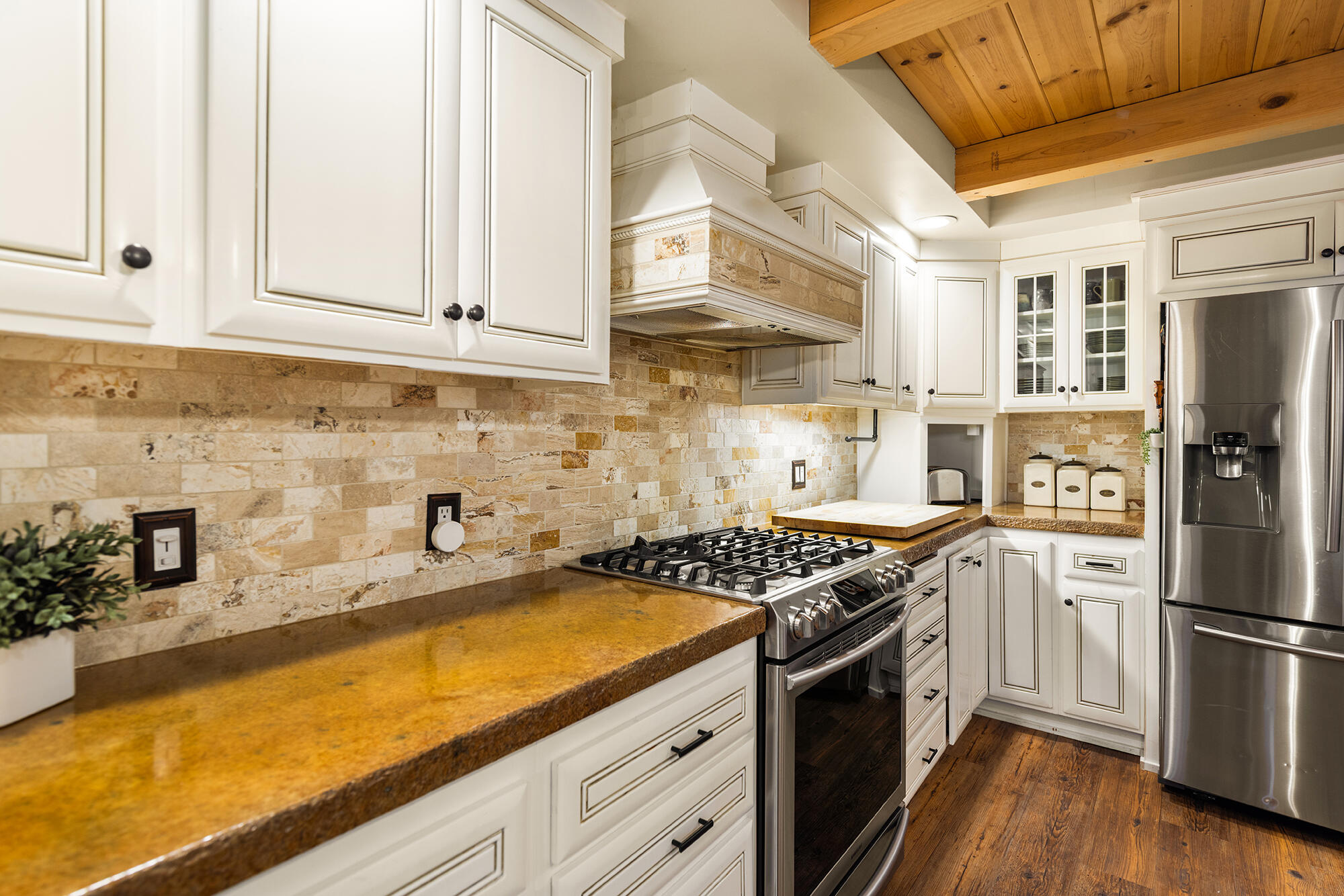 12475 Christmas Tree Road Ojai, CA 93023 - Photo 10 of 50 a kitchen with stainless steel appliances granite countertop a stove a sink dishwasher and refrigerator with wooden floor