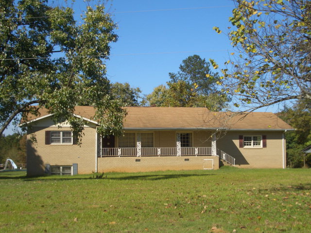 271 Chambers Road Macon, GA 31217 - Photo 1 of 1 a front view of a house with a garden