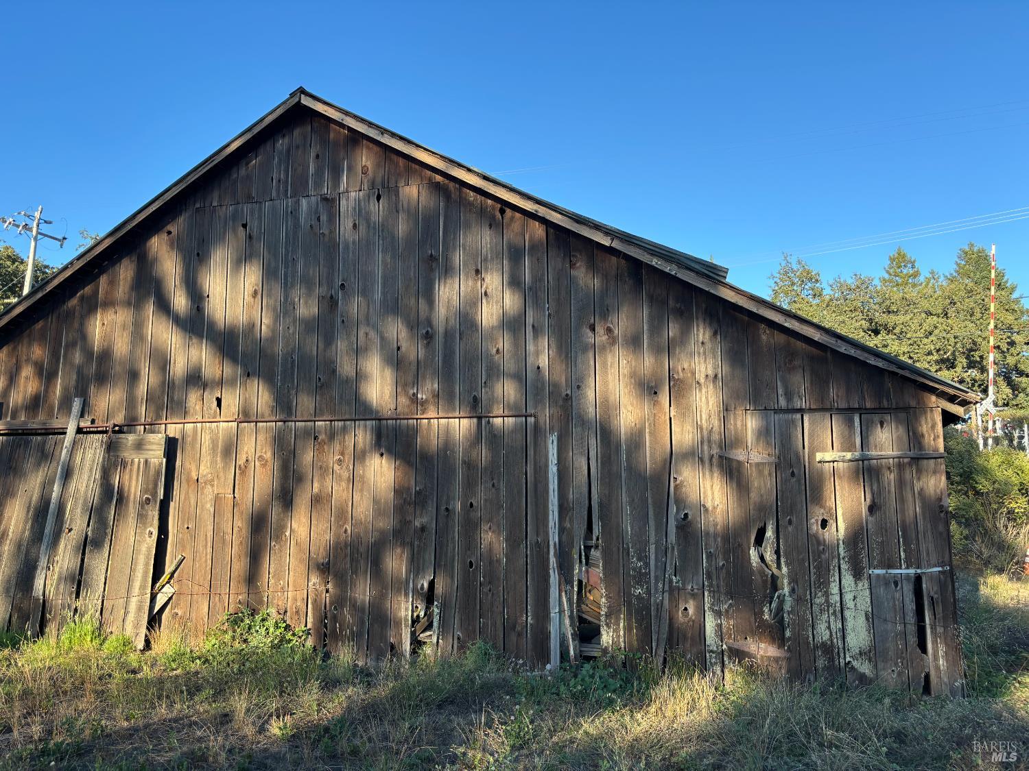 1100 Hart Lane Fulton, CA 95439 - Photo 19 of 30 a black and white building with trees in the background