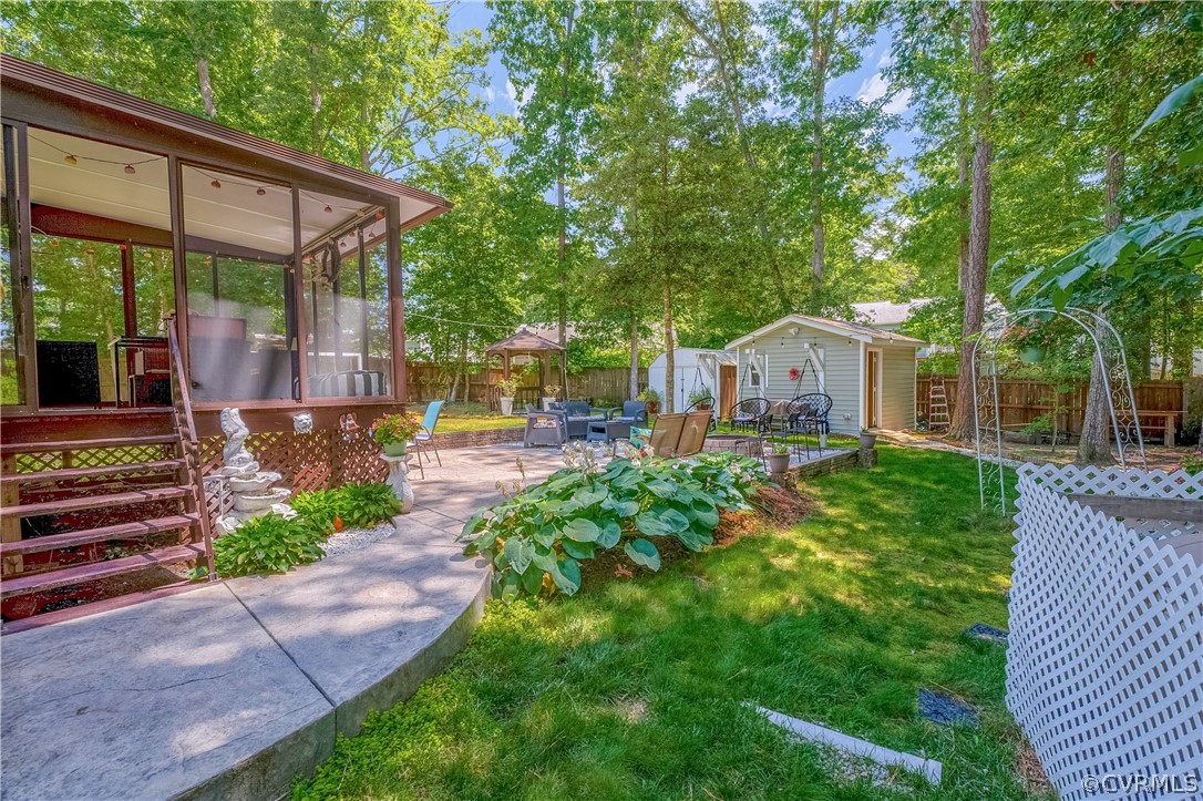 5423 Ridgerun Terrace Chesterfield, VA 23832 - Photo 6 of 33 a front view of a house with a yard table and chairs