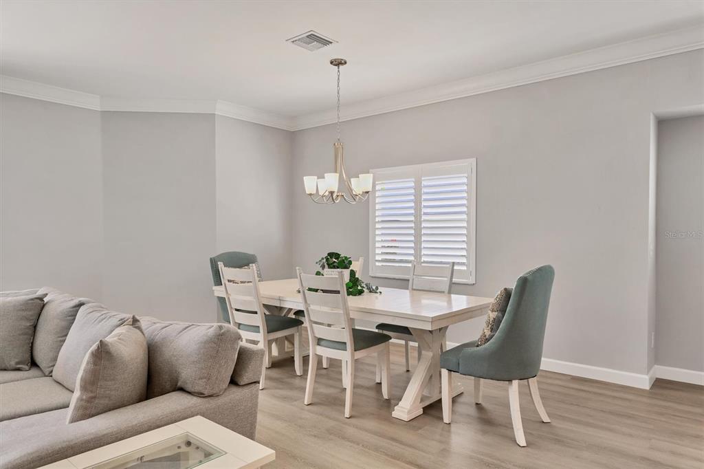 5956 Rachele Drive Sarasota, FL 34243 - Photo 13 of 37 a dining room with furniture and window