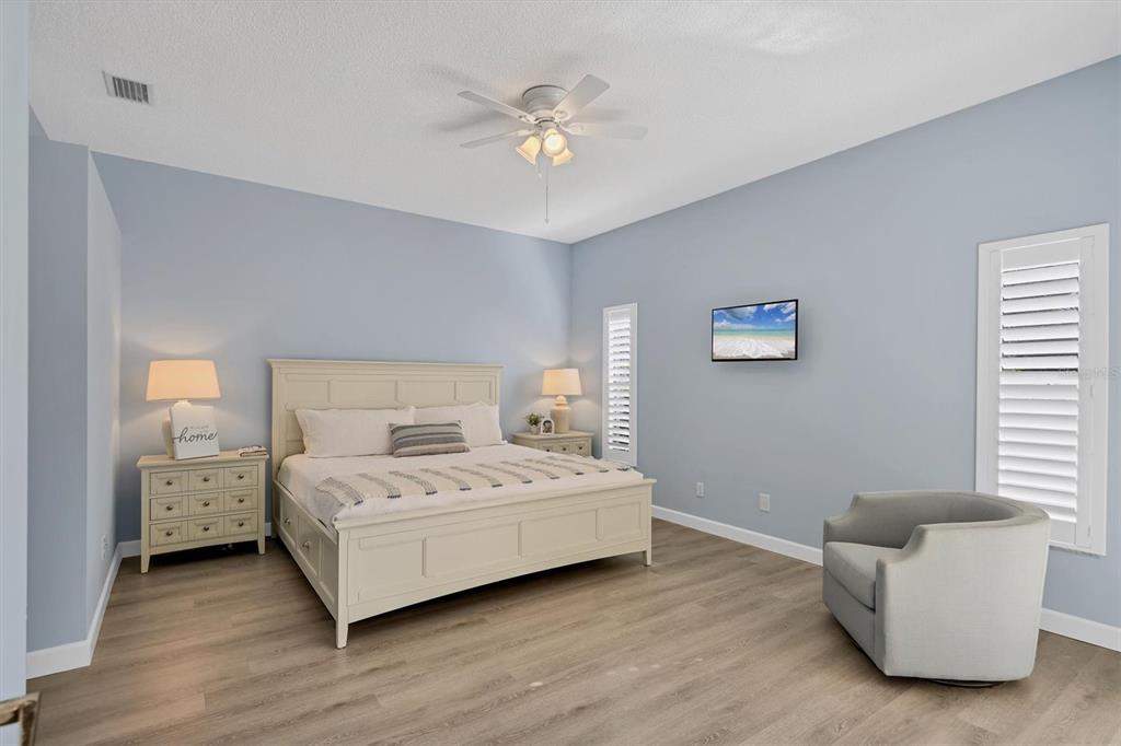 5956 Rachele Drive Sarasota, FL 34243 - Photo 14 of 37 a bedroom with a bed and a couch