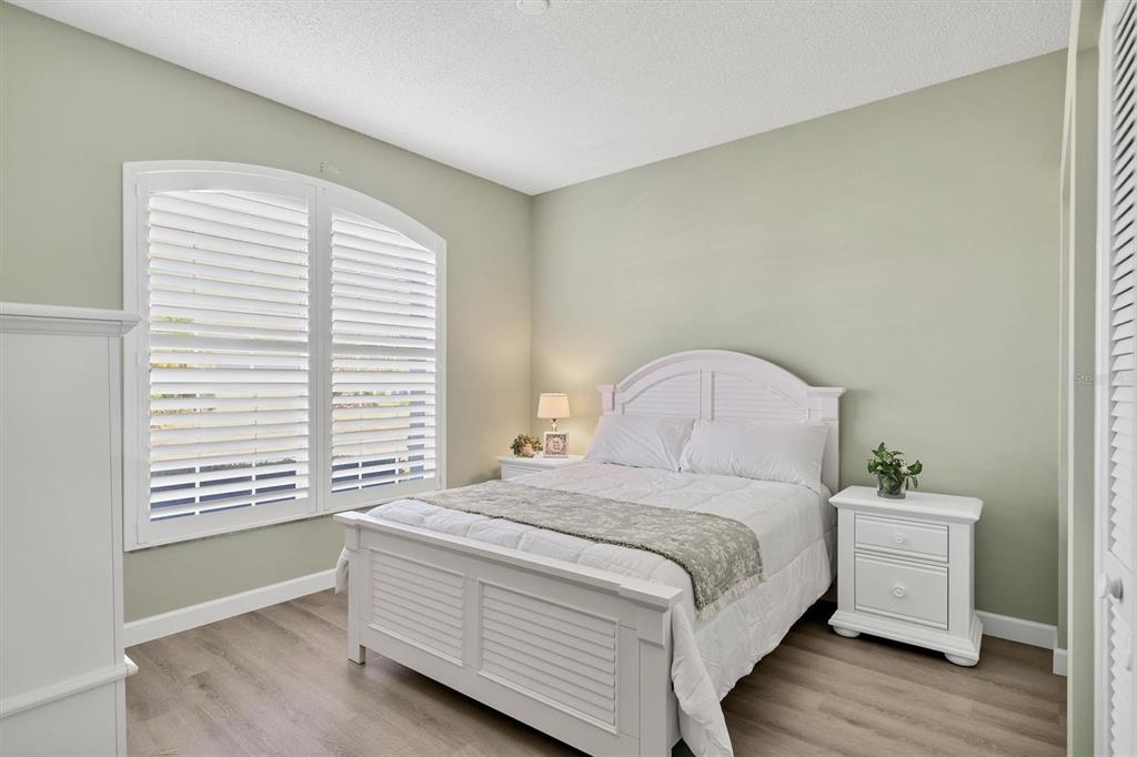 5956 Rachele Drive Sarasota, FL 34243 - Photo 20 of 37 a bedroom with a bed and a window