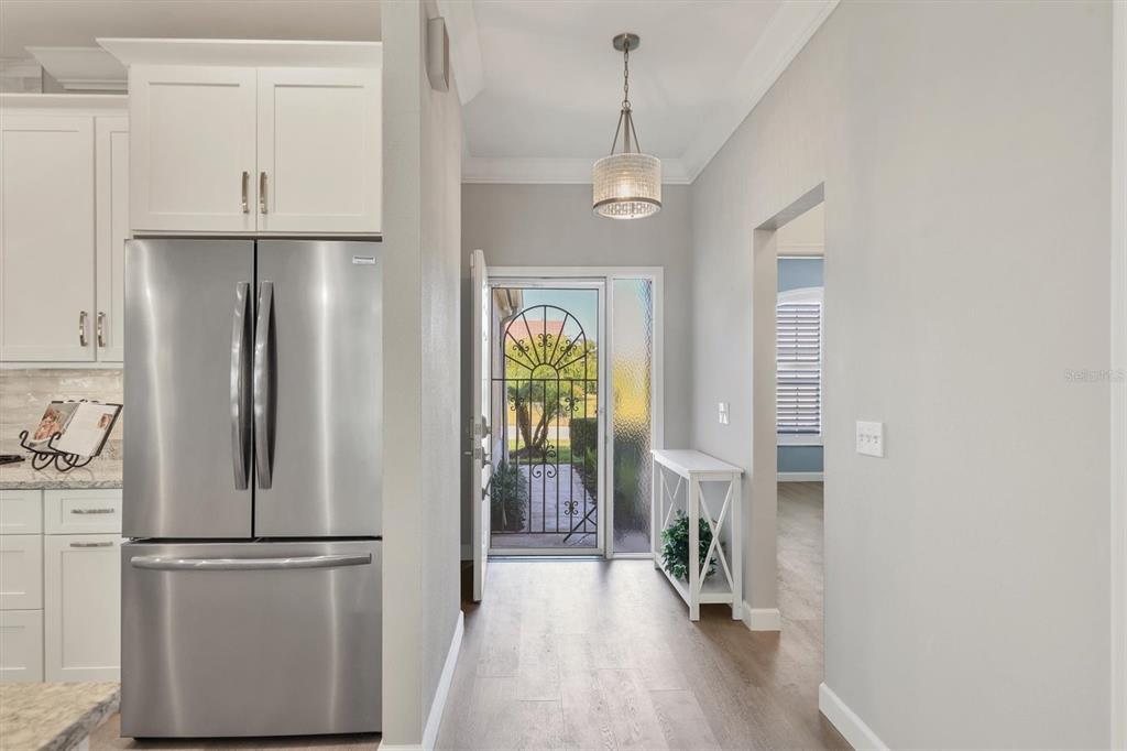 5956 Rachele Drive Sarasota, FL 34243 - Photo 3 of 37 a kitchen with stainless steel appliances granite countertop a refrigerator and a stove top oven