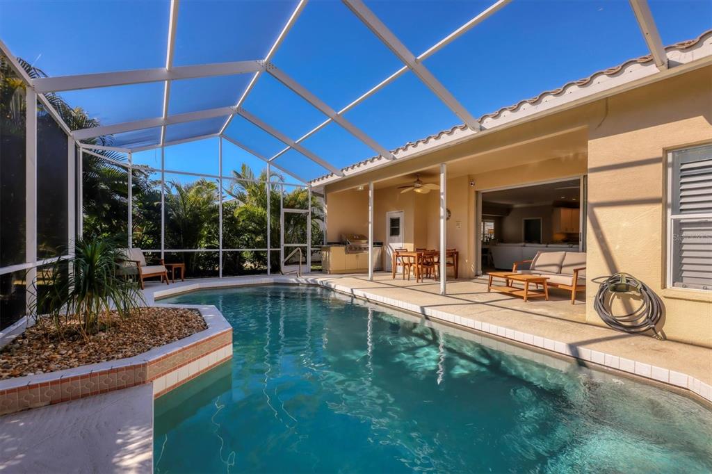 5956 Rachele Drive Sarasota, FL 34243 - Photo 31 of 37 a view of a backyard with swimming pool and patio