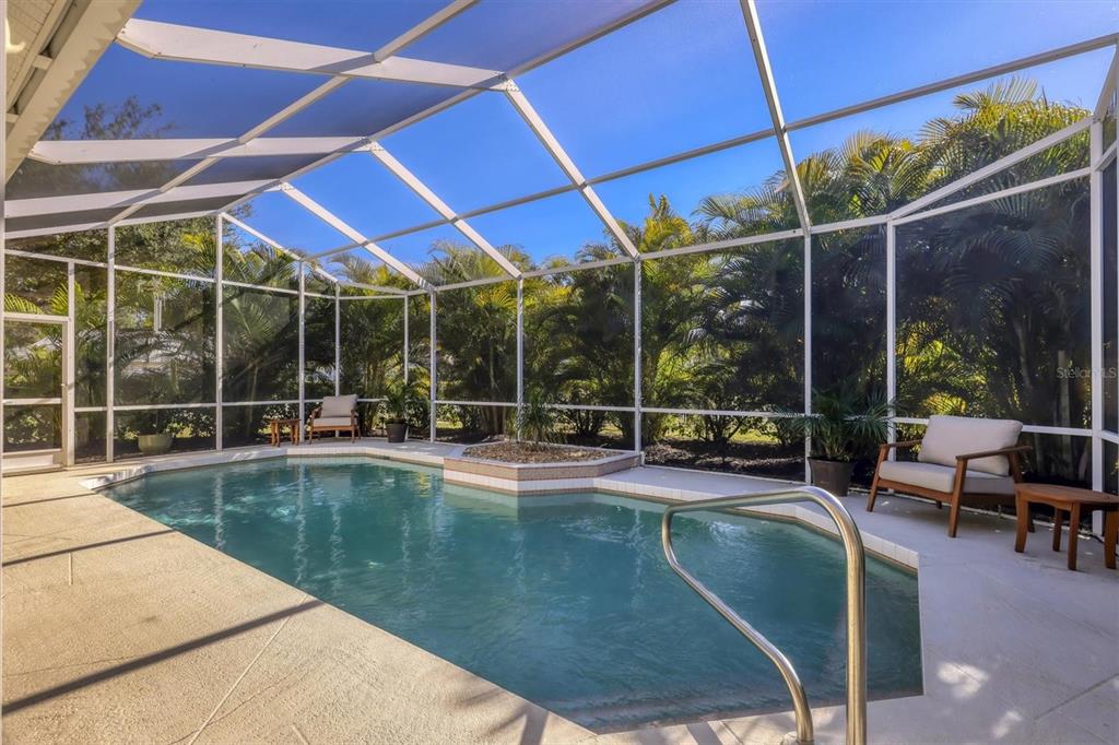 5956 Rachele Drive Sarasota, FL 34243 - Photo 32 of 37 a view of a swimming pool with a patio