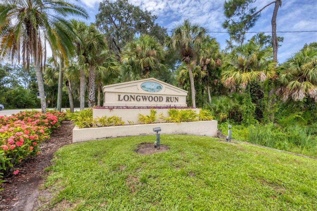 5956 Rachele Drive Sarasota, FL 34243 - Photo 34 of 37 a sign that is sitting in front of flowers