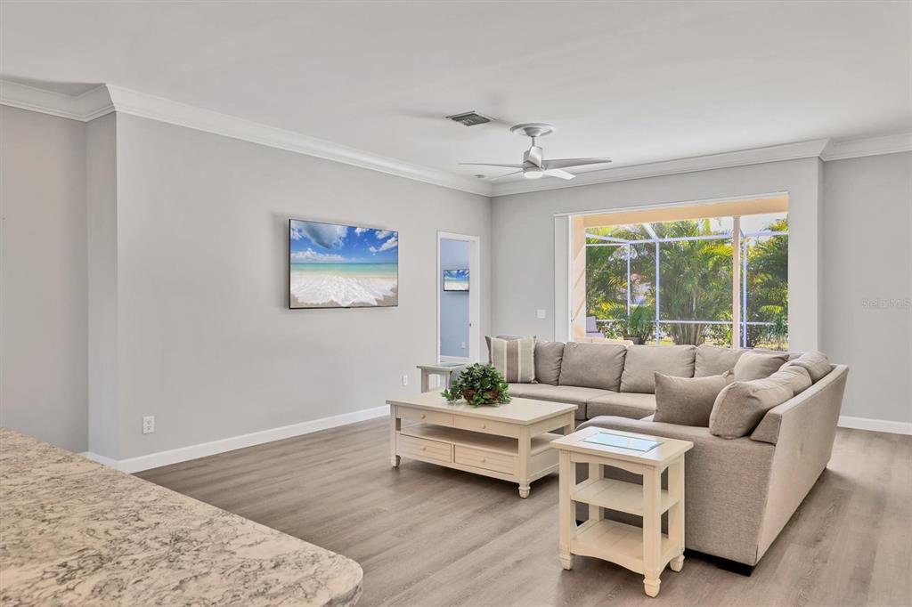 5956 Rachele Drive Sarasota, FL 34243 - Photo 4 of 37 a living room with furniture and a large window