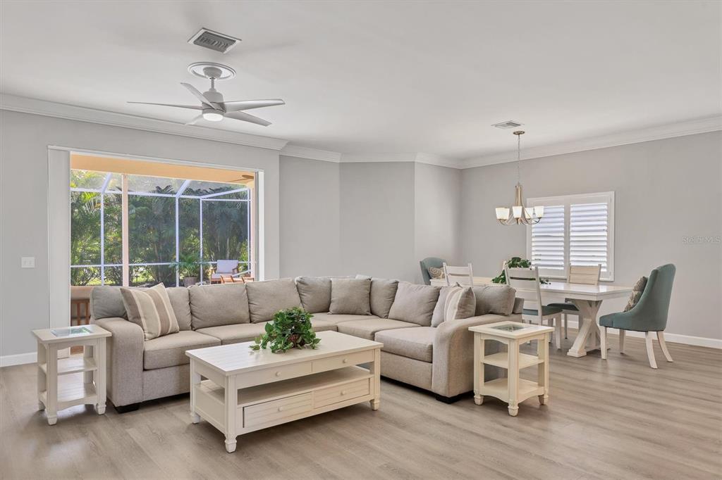 5956 Rachele Drive Sarasota, FL 34243 - Photo 5 of 37 a living room with furniture and a large window