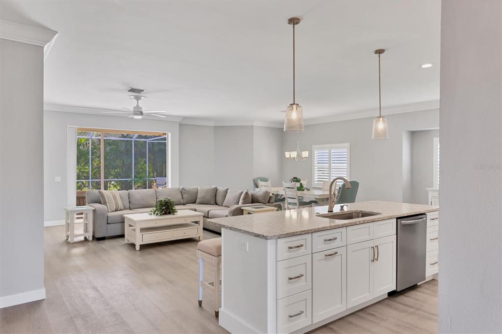 5956 Rachele Drive Sarasota, FL 34243 - Photo 7 of 37 a kitchen with a sink stove and cabinets