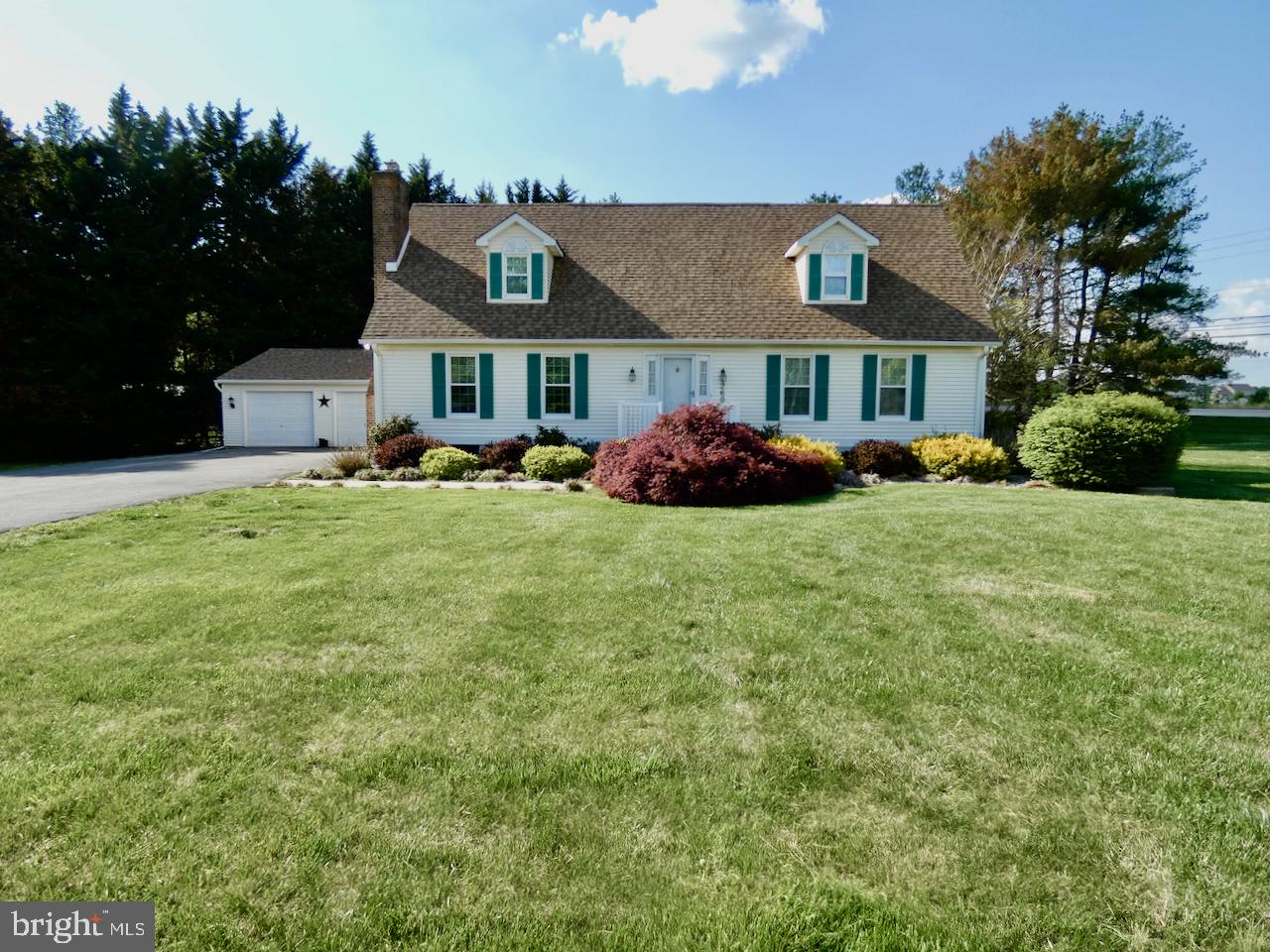 Charming home with lush gardens.