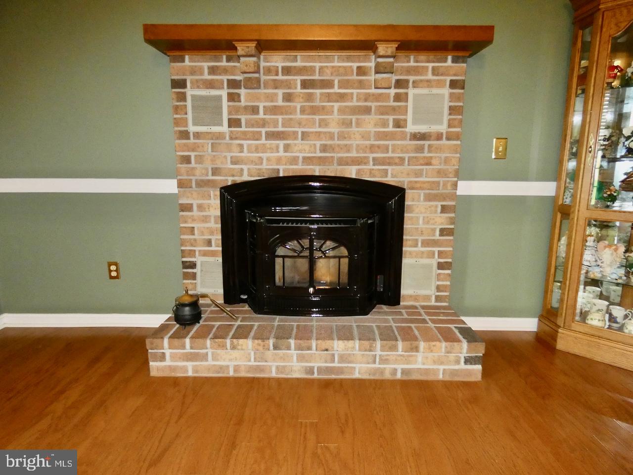 260 Clarks Corner Road New Castle, DE 19720 - Photo 13 of 85 Cozy brick fireplace centerpiece.
