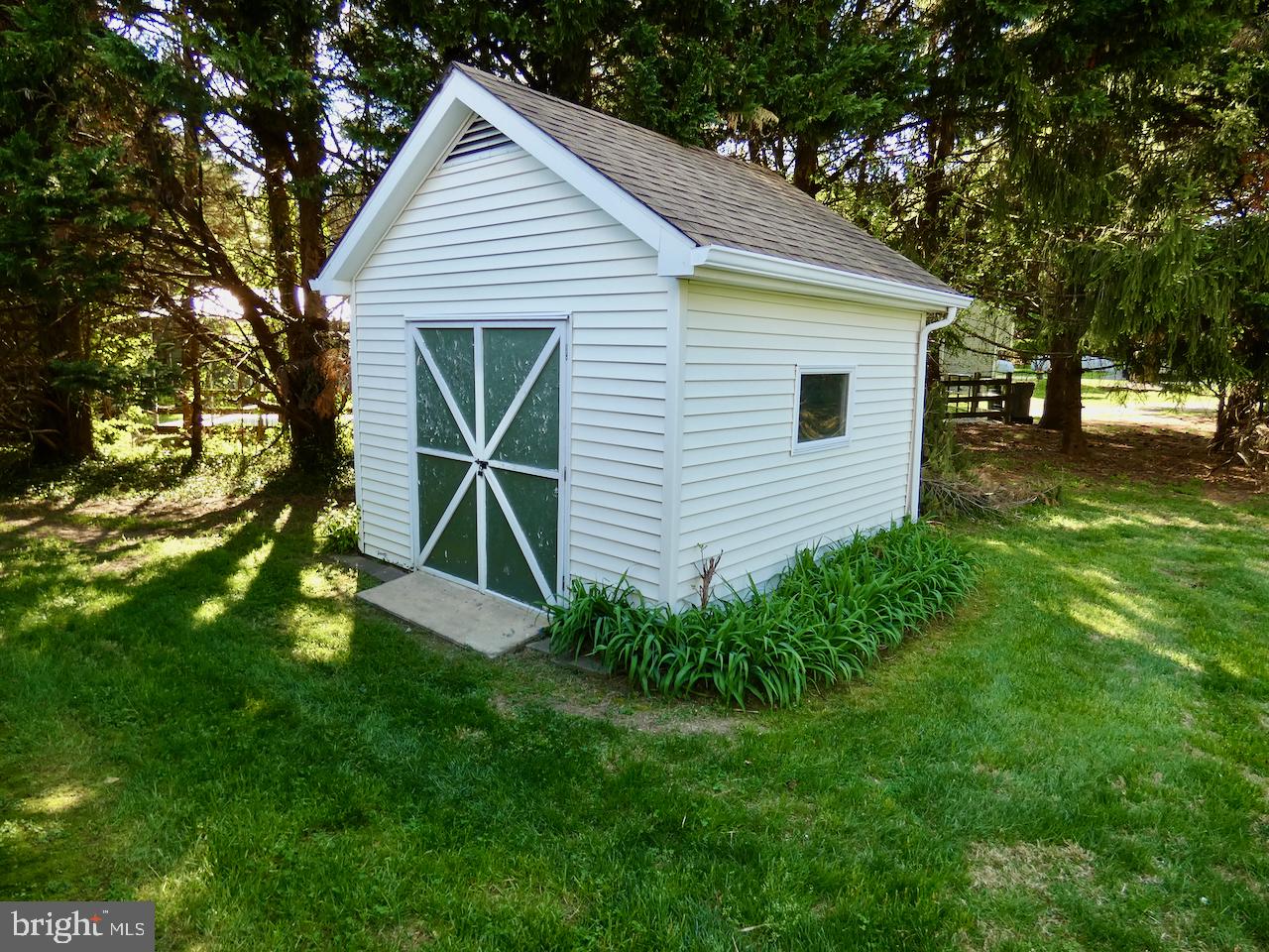 260 Clarks Corner Road New Castle, DE 19720 - Photo 67 of 85 Charming garden shed nestled in greenery.