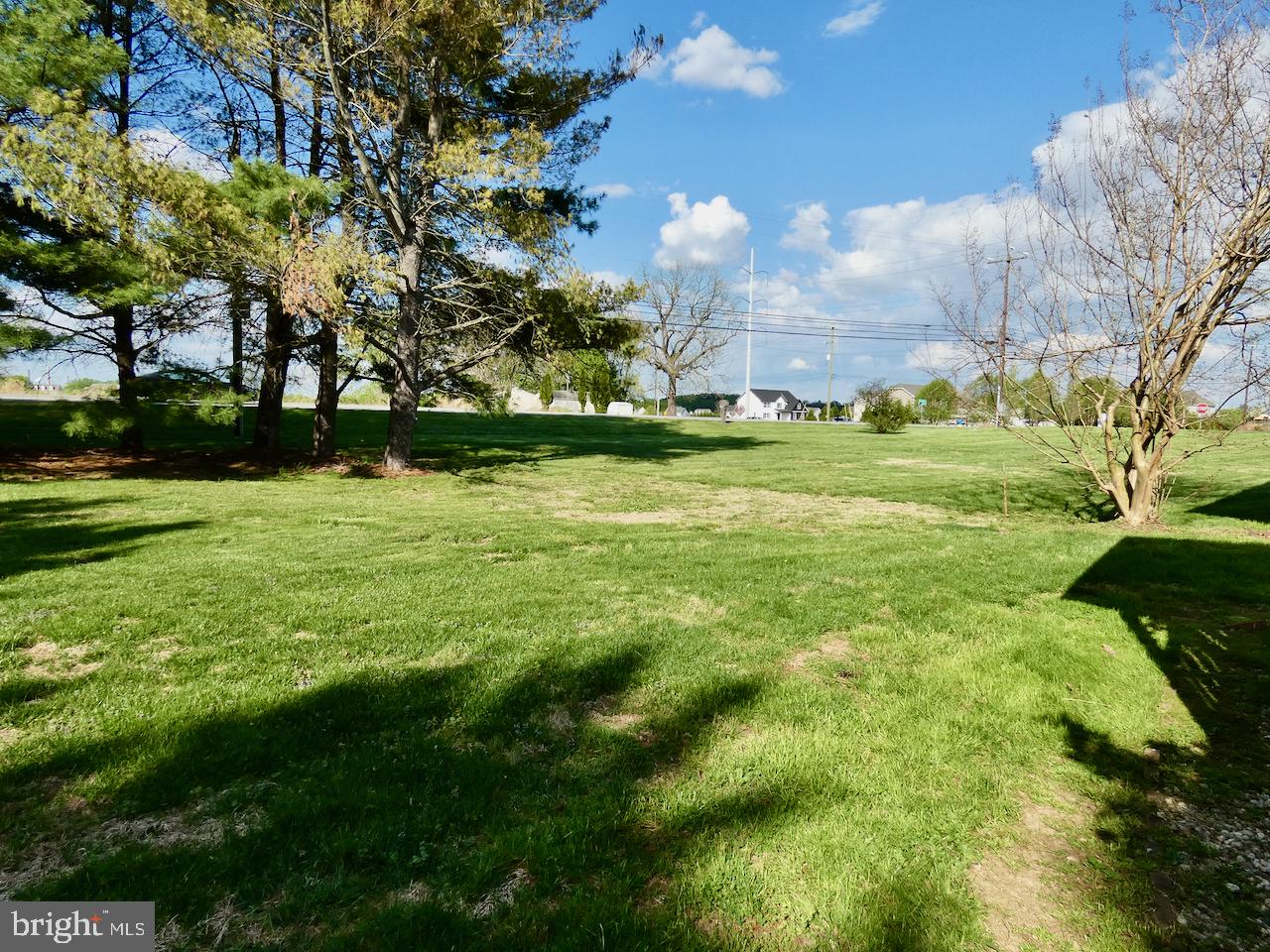 260 Clarks Corner Road New Castle, DE 19720 - Photo 79 of 85 Spacious green landscape under blue skies.
