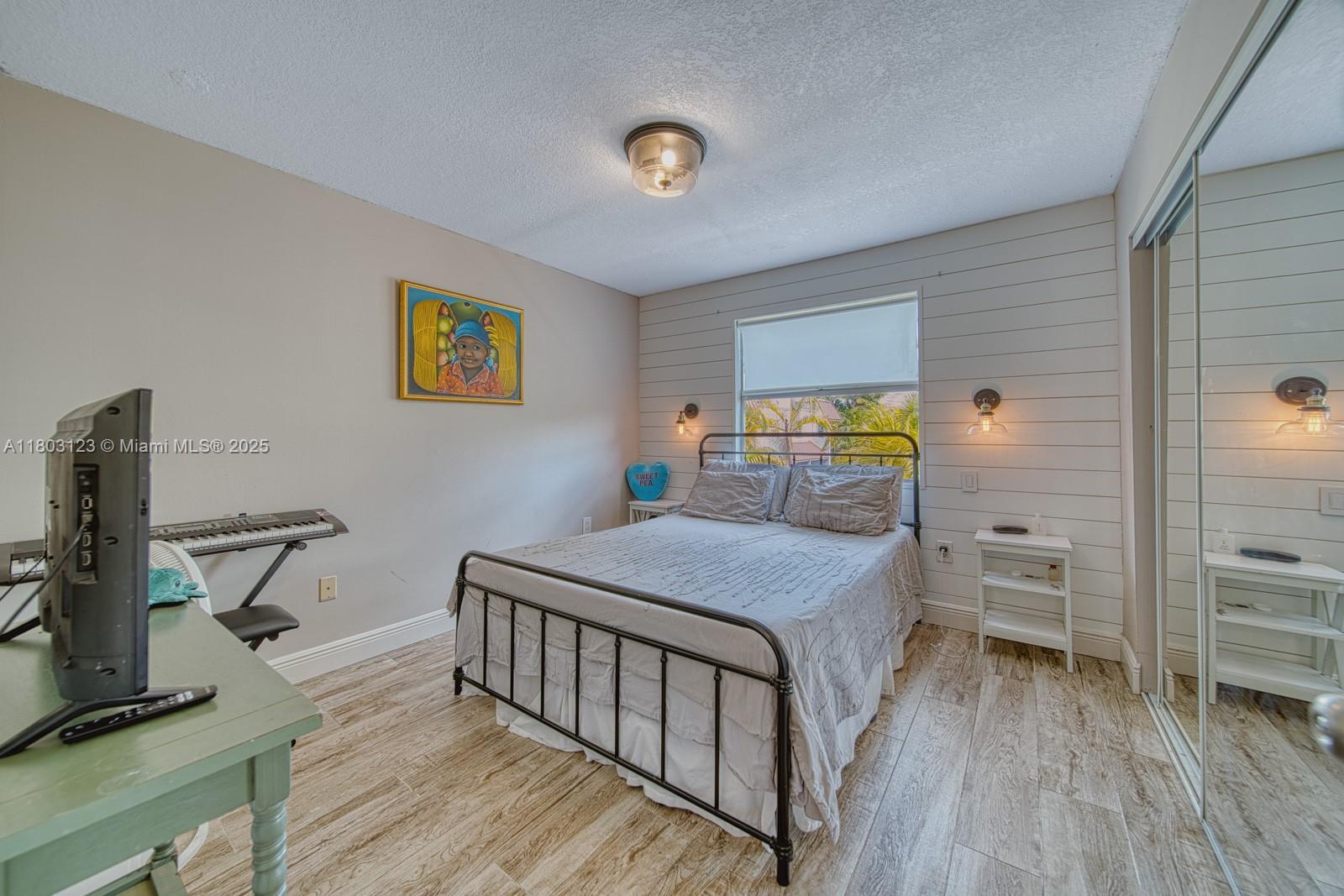 Glenvar Heights Miami, FL 33155 - Photo 20 of 30 a bedroom with a bed and a view of kitchen