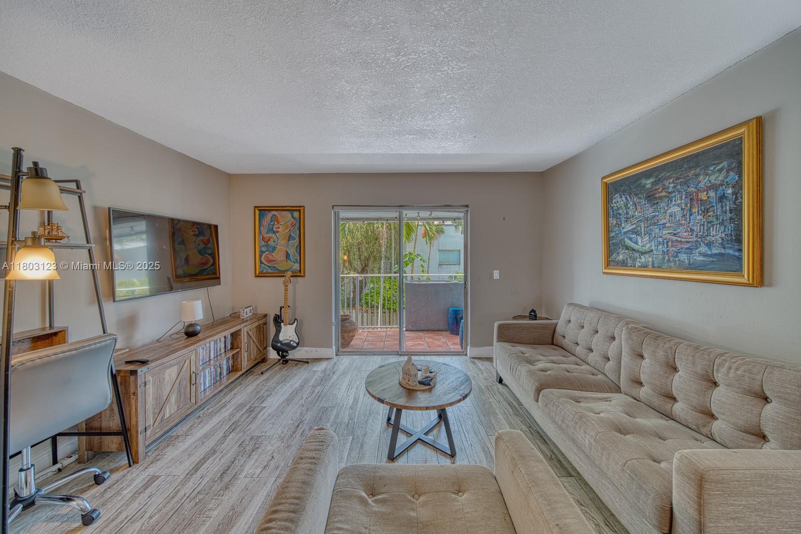 Glenvar Heights Miami, FL 33155 - Photo 4 of 30 a living room with furniture and a flat screen tv
