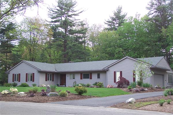 62 Prynne Ridge Road Longmeadow, MA 01106 - Photo 2 of 30 a front view of a house with a yard and garage