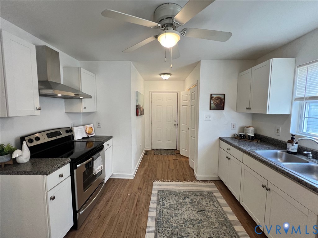 2604 Perry Street Richmond, VA 23225 - Photo 12 of 30 a kitchen with a stove and a refrigerator
