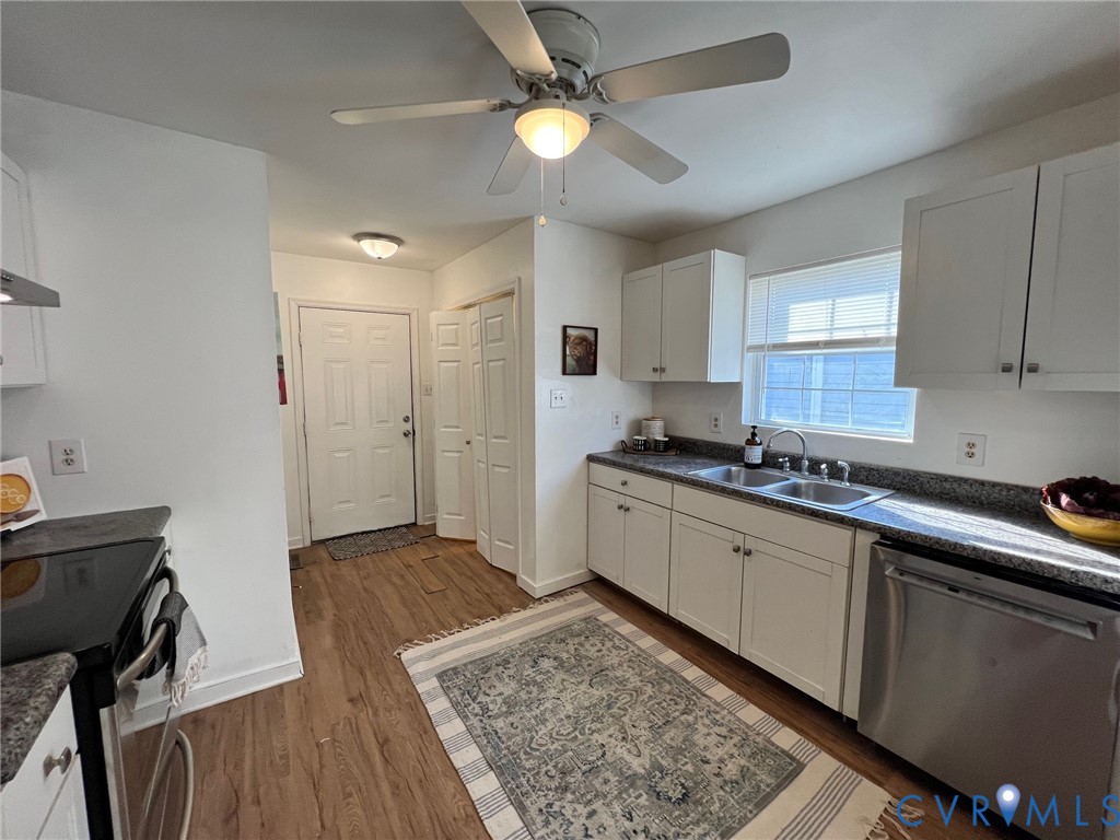 2604 Perry Street Richmond, VA 23225 - Photo 13 of 30 a kitchen with a stove a sink and a refrigerator